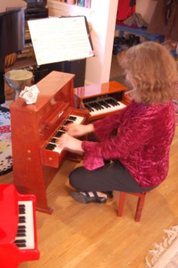 Paula with toy pianos